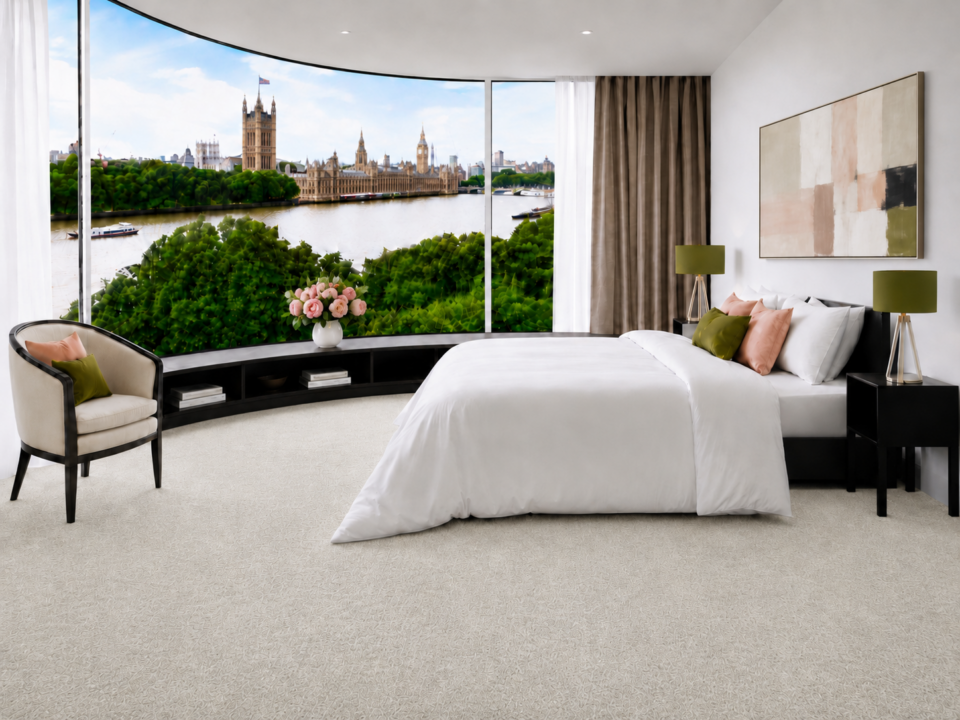 Image of Riviera Home's carpet Fiesta in colour Champagne Fizz installed in bedroom overlooking the Thames, London