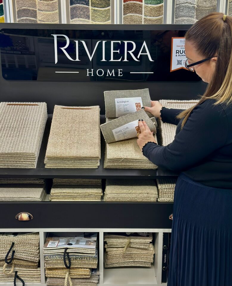 Riviera Home Carpet Display Stand with customer viewing our ranges.